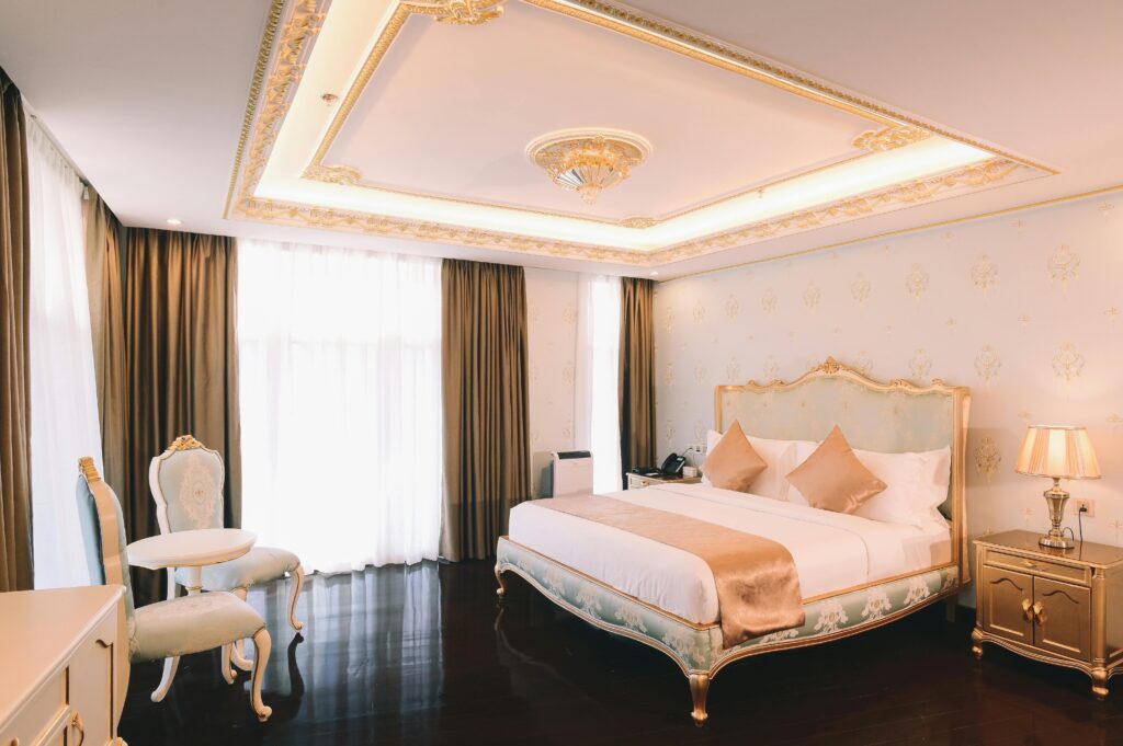 Elegant hotel room with luxury furnishings and soft lighting, perfect for relaxation.
